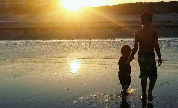 Kids walking on the beach